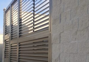 Read more about the article Seeing Through the Options: Louvered vs. Perforated Screen Systems