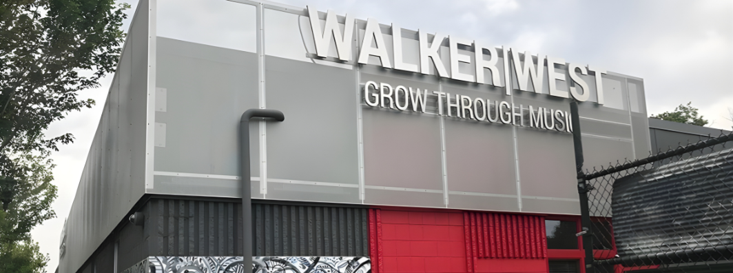 Walker West perforated panel façade entrance of renovated building