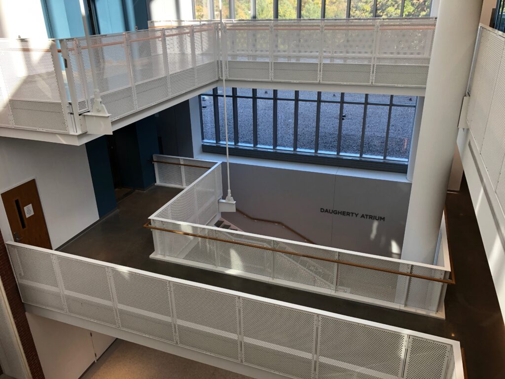 three story staircase of perforated guardrail