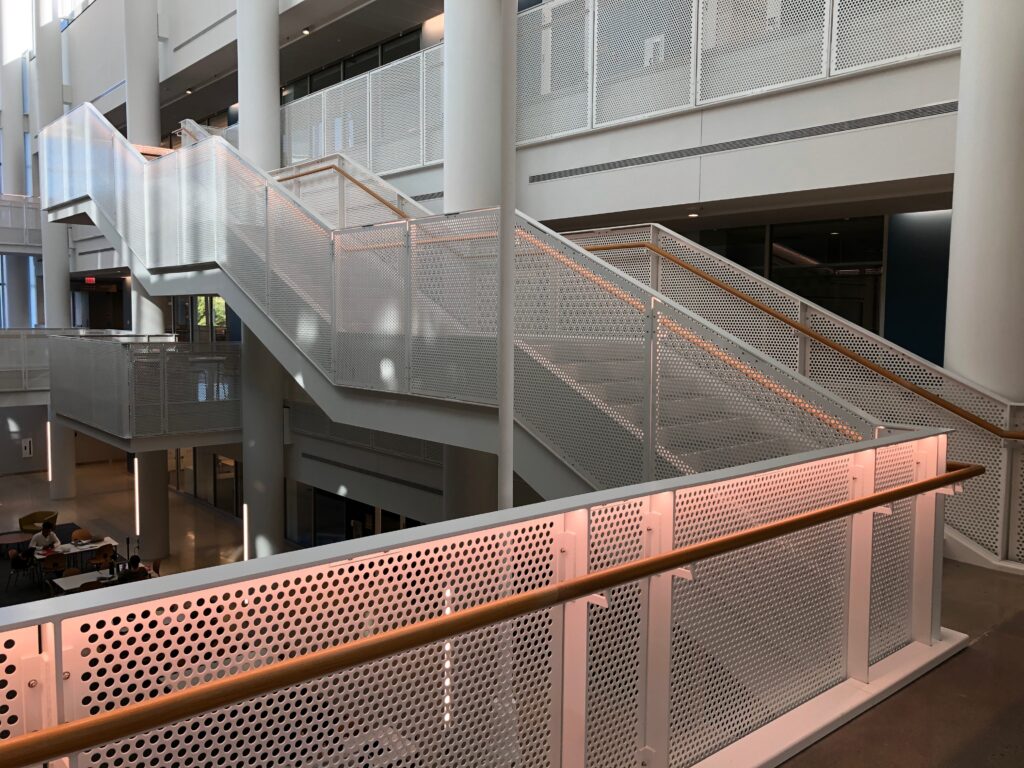 perforated metal guardrail for three story staircase