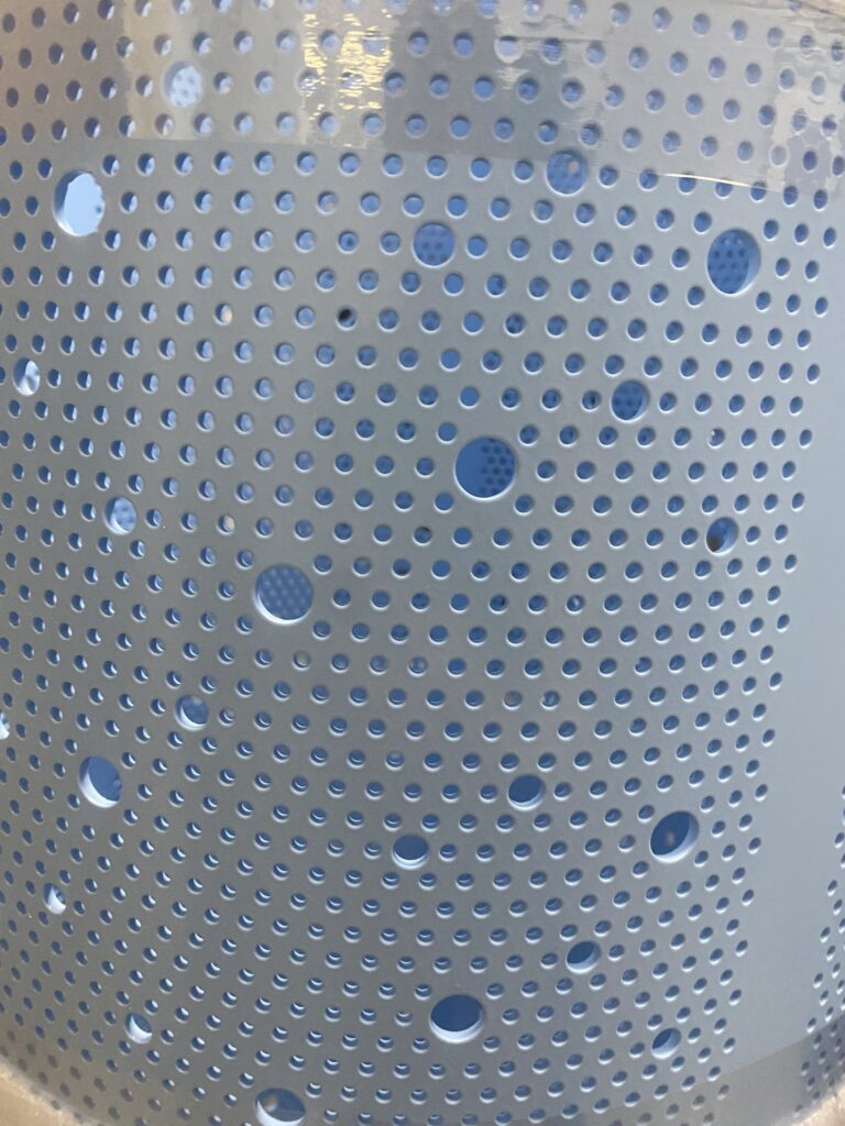 light blue Ecolab light pole perforations
