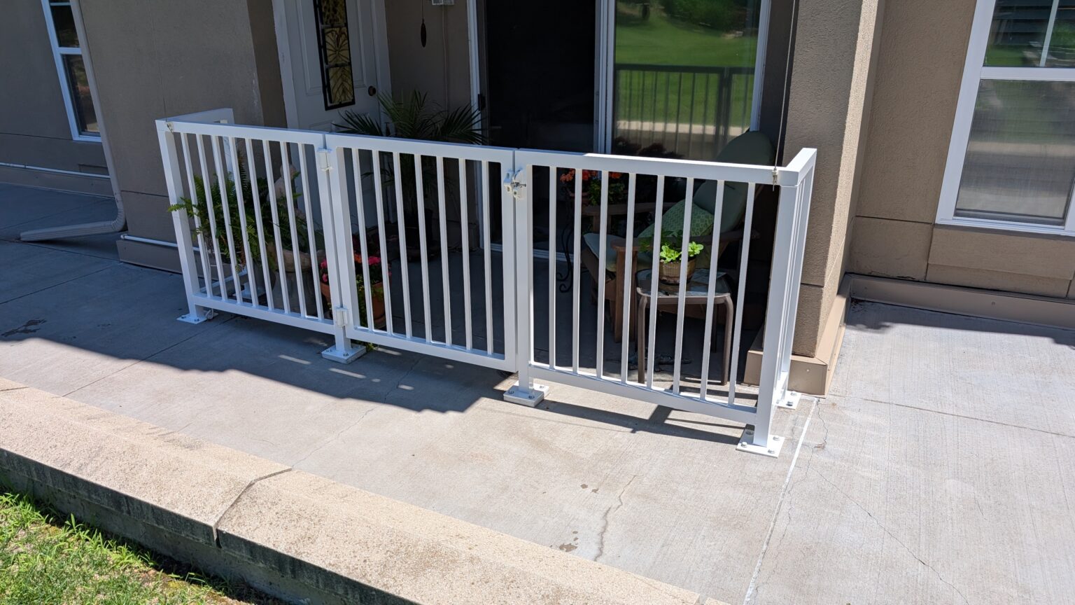 ground level apartment balcony with gate